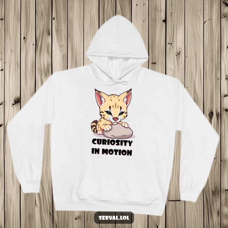Funny serval hoodie showing a serval playfully nudging a smooth pebble with its nose, designed for cozy exploration and lightheartedness.