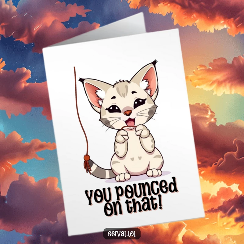 Funny Free Printable Congratulations Card: A serval is actively and playfully batting at a dangling string.