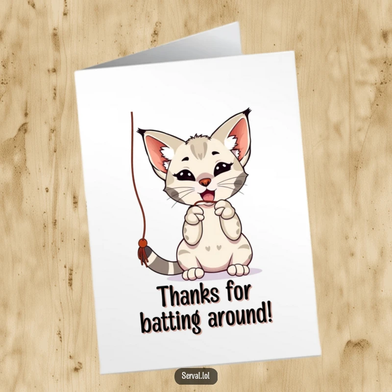 Funny Free Printable Thank You Card: A serval is captured mid-play, batting at a dangling string.