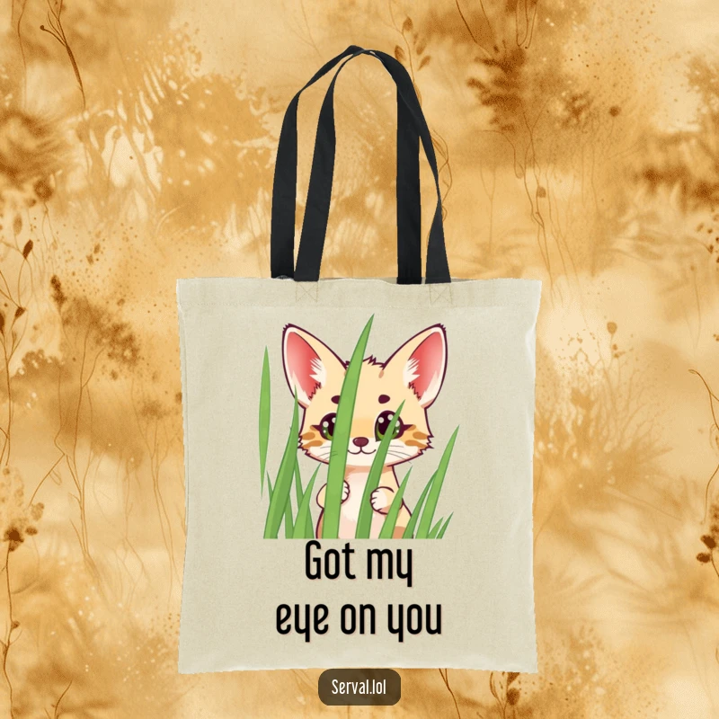 Funny Serval Tote Bag showcasing a cheerful serval peeking with wide eyes from behind grass, perfect for carrying essentials with personality.